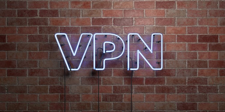 VPN acronym in neon lights against a brick wall.